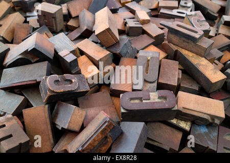 Heap of old carved wooden letters Stock Photo