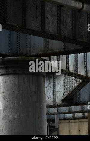 Grey painted steel girders and columns of a coal landing jetty at Greenwich Power Station Stock Photo