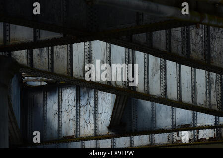 Grey painted steel girders of a coal landing jetty at Greenwich Power Station Stock Photo