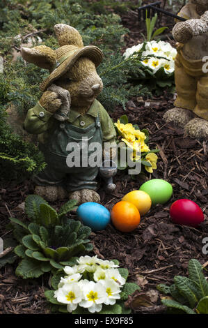 Easter eggs and bunnies in garden Stock Photo