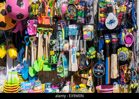 Colourful beach toys and novelties on display outside a shop in Padstow, Cornwall. Stock Photo