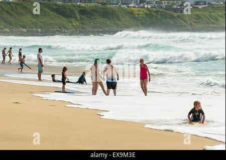 Holidaymakers enjoying themselves on Fistral Beach in Newquay, Cornwall.