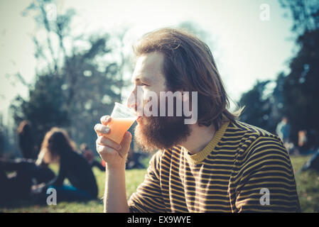 young bearded stylish handsome hipster man outdoors Stock Photo