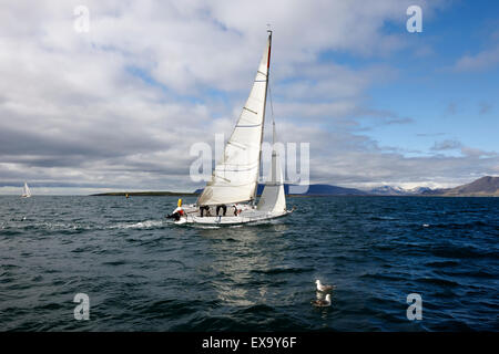 yacht sailing over faxafloi faxa bay from reykjavik iceland Stock Photo