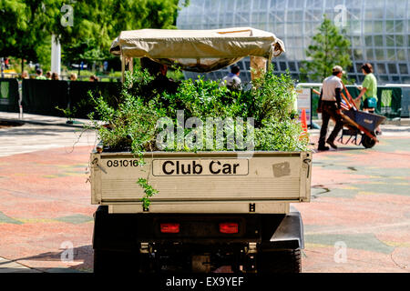 A small truck called a Club Car filled with shrubbery for planting in the Myriad Botanical Gardens in Oklahoma City, USA Stock Photo