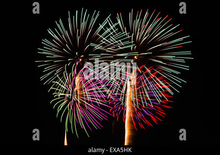 An image of exploding fireworks at night. Represents a celebration. Stock Photo