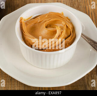 Creamy peanut butter in spoon isolated on white background, closeup. A  traditional product of American cuisine Stock Photo - Alamy