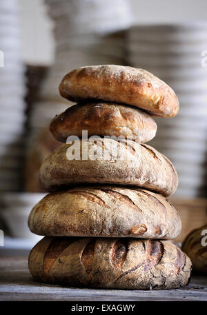 Stack of bread at the artisan bakery of Alex Gooch in Hay-on-Wye, Herefordshire UK Stock Photo