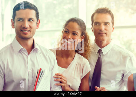 Business associates sharing lighthearted moment together Stock Photo