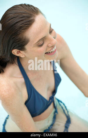 Woman relaxing in swimming pool Stock Photo