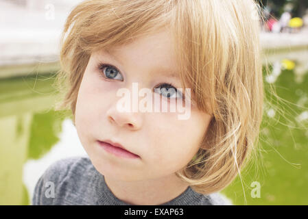 Little girl looking away in thought, portrait Stock Photo