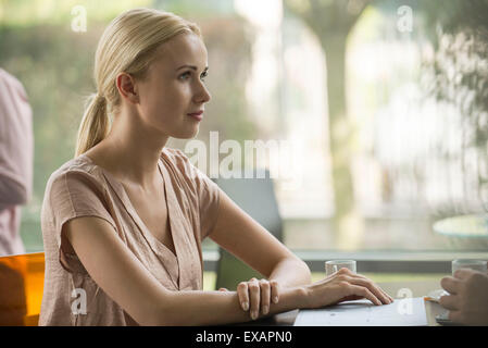 Woman having coffee with friend Stock Photo