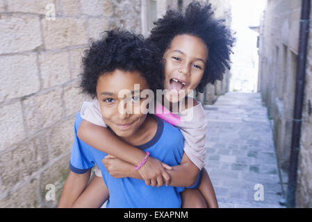 Brother and sister having fun together outdoors, portrait Stock Photo