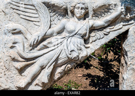 Stone carving of the goddess Nike at Hercules Gate, Ephesus, Izmir, Turkey Stock Photo