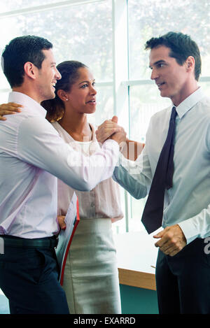 Businessmen congratulating each other Stock Photo