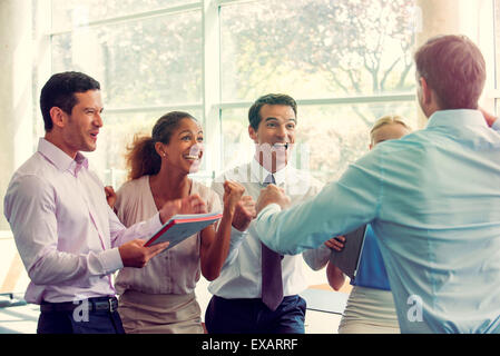 Business team members celebrating success Stock Photo