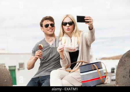 young couple making selfie shoots in the city Stock Photo