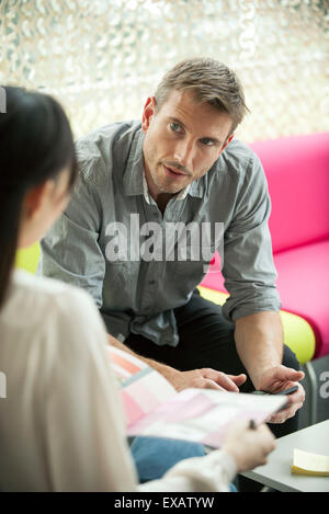 Designer meeting with client Stock Photo