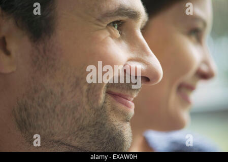 Couple in profile, smiling Stock Photo