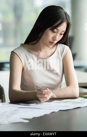 College student taking exam Stock Photo