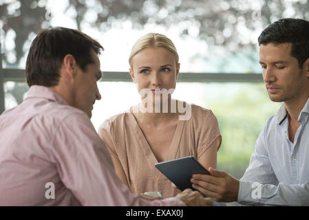 Colleagues having working coffee break Stock Photo