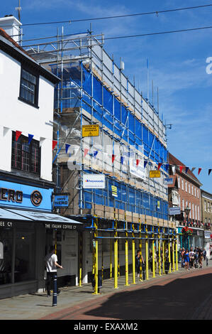 Scaffolding on town centre building, High Street, Hitchin, Hertfordshire, England, UK Stock Photo