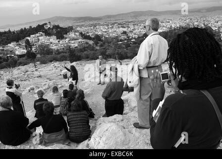 Tourists on the rock of Areopagos, Athens, Greece Stock Photo