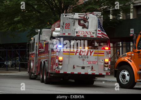 Tower ladder fire truck rear view with flag Manhattan New York USA