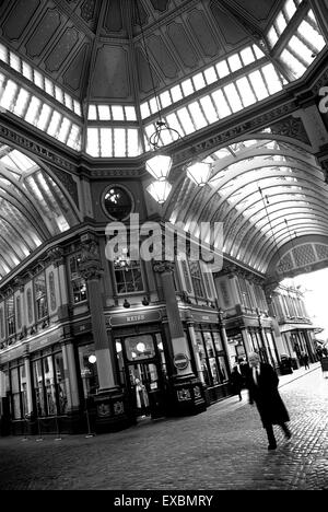 Banker walking through Leadenhall Market, The city of London Stock Photo