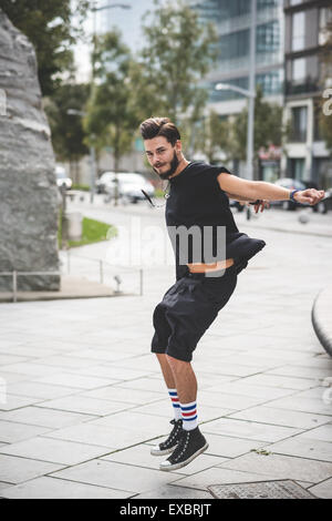 young handsome bearded hipster man in the city Stock Photo