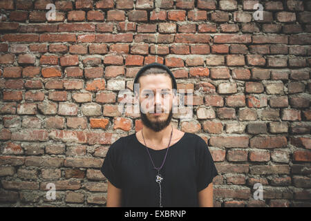 young handsome bearded hipster man in the city Stock Photo