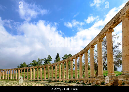 View of the Oval Forum colonnade in ancient Jerash, Jordan - Jerash is the site of the ruins of the Greco-Roman city of Gerasa. Stock Photo