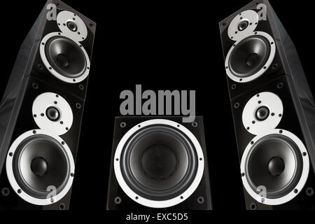 Pair of black music speakers and subwoofer isolated on black background Stock Photo