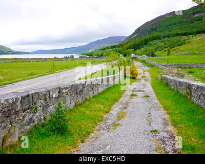 The A835 running along side the old road and bridge, Inverleal, Wester-Ross,Scotland,UK. Stock Photo