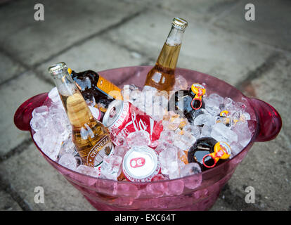 Variety of summer drinks cooling in an ice bucket Stock Photo