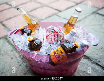 Variety of summer drinks cooling in an ice bucket Stock Photo