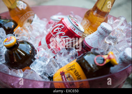 Variety of summer drinks cooling in an ice bucket Stock Photo
