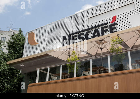 Tokyo, Japan. 11th July, 2015. A view of the NESCAFE coffee-shop in Harajuku area on July 11, 2015, Tokyo, Japan. Six robots are programmed to interact with people while introducing the Nescafe products during a special event ''The world? Future cafe by NESCAFE with Pepper'' on Saturday July 11th. The store will continue to employ two robots as regular staff to introduce the shop's products and services. Credit:  Rodrigo Reyes Marin/AFLO/Alamy Live News Stock Photo