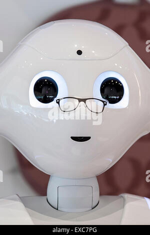 Tokyo, Japan. 11th July, 2015. The humanoid robot Pepper debuted as a new member of staff at the NESCAFE coffee-shop in Harajuku on July 11, 2015, Tokyo, Japan. Six robots are programmed to interact with people while introducing the Nescafe products during a special event ''The world? Future cafe by NESCAFE with Pepper'' on Saturday July 11th. The store will continue to employ two robots as regular staff to introduce the shop's products and services. Credit:  Rodrigo Reyes Marin/AFLO/Alamy Live News Stock Photo