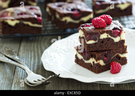 Cheesecake brownies with raspberry stacked on a plate Stock Photo