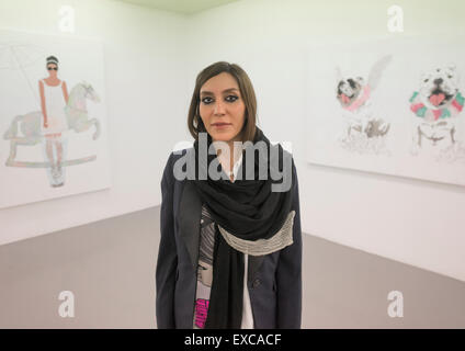 Elnaz Pausing In Front Of Her Painting, Shemiranat County, Tehran, Iran Stock Photo