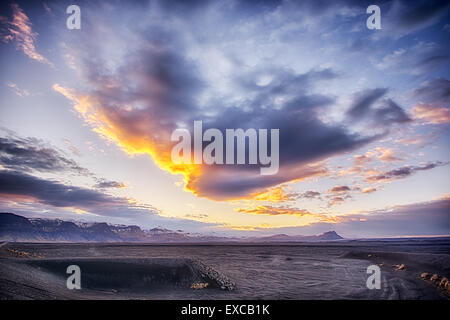 Sunset over the black sands wastelands of Iceland Stock Photo