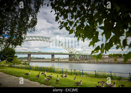 Runcorn is an industrial town and cargo port in Halton, Cheshire, UK.  Pictured The Silver Jubilee Bridge or Runcorn Bridge cros Stock Photo