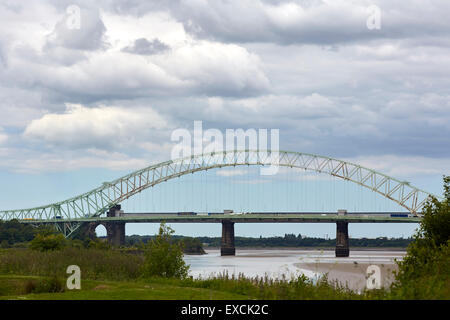 Runcorn is an industrial town and cargo port in Halton, Cheshire, UK.  Pictured The Silver Jubilee Bridge or Runcorn Bridge cros Stock Photo