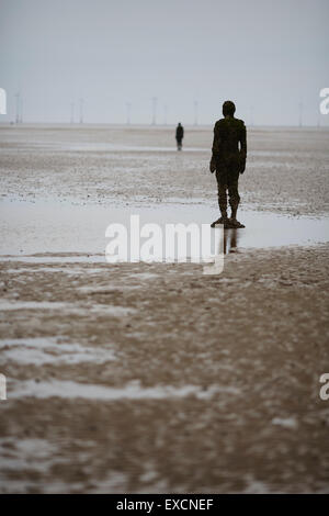 Pictures around Southport   Another Place is a piece of modern sculpture by Antony Gormley. It consists of 100 cast iron sculptu Stock Photo