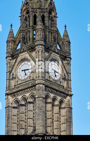 Close-up of manchester Town hall clock tower exterior   Clock face roman numerals numbers time gothic    UK Great Britain Britis Stock Photo