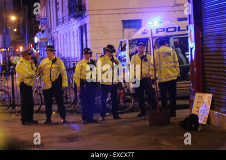 London, UK. 11th July, 2015. Police reinforcements arrive at a demonstration in Camden. The peaceful march turned violent when anti-fascist protesters encountered attendees of an alleged 'white pride' gig. Credit:  Finn Nocher/Alamy Live News Stock Photo