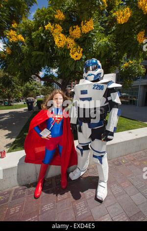 San Diego, CA, US. 11th July, 2015. COMIC-CON INTERNATIONAL returns to San Diego. People come from all over the world to attend the four day event. Some come without passes, just to people watch. There are all kinds of activities for all who brave the crowds. Seen here: Supergirl, and Halo taking a break.Supergirl Rory Dawson 11 years old from San Diego, and Halo Shane Holly 38 also from San Diego Credit:  Daren Fentiman/ZUMA Wire/Alamy Live News Stock Photo