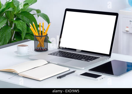 Laptop mockup with tablet computer, smartphone and notebook on the modern office desk. For design presentation or portfolio. Stock Photo