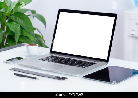 Modern office workspace with laptop computer, tablet pc and smartphone on the desk. For design presentation or portfolio. Stock Photo